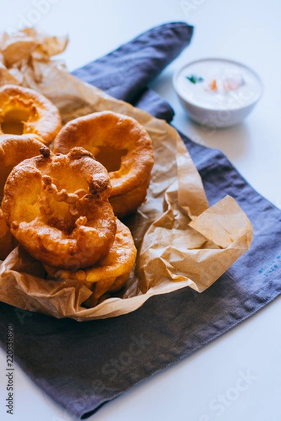 Fototapeta Yorkshire pudding with smoked salmon and sour cream on baking paper