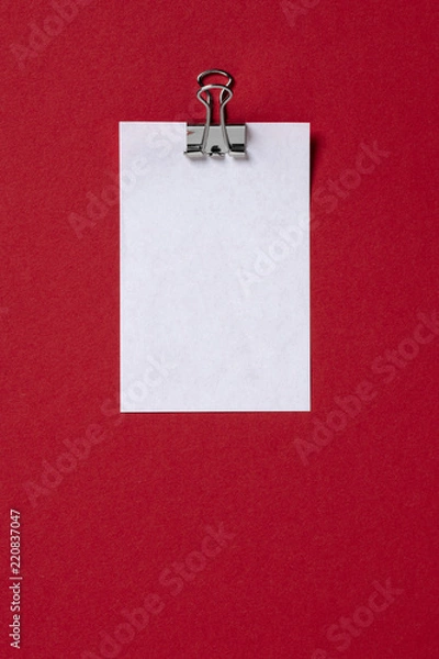 Fototapeta white paper massage on red background. Flat lay, top view trendy for banner