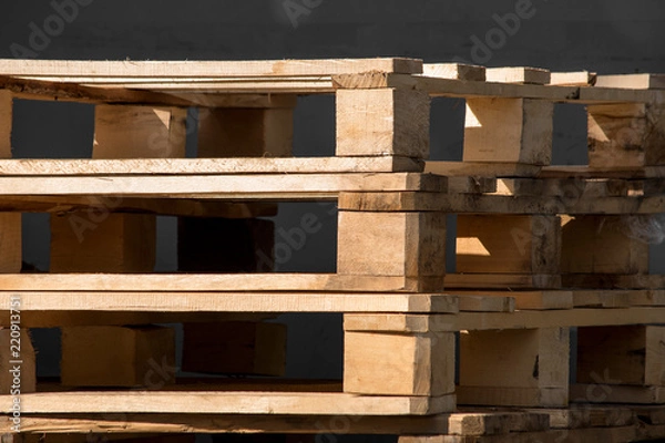 Fototapeta A stack of wooden pallets is close