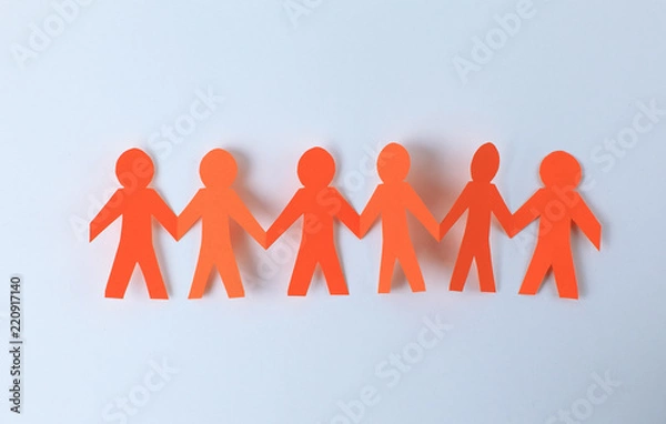 Obraz four paper men taking each other's hands