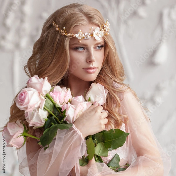 Fototapeta Delicate portrait of a young model girl. The image of the bride, a light lace dress in pink, a beautiful hairstyle and a natural make-up. Light photo studio, natural light from the window.