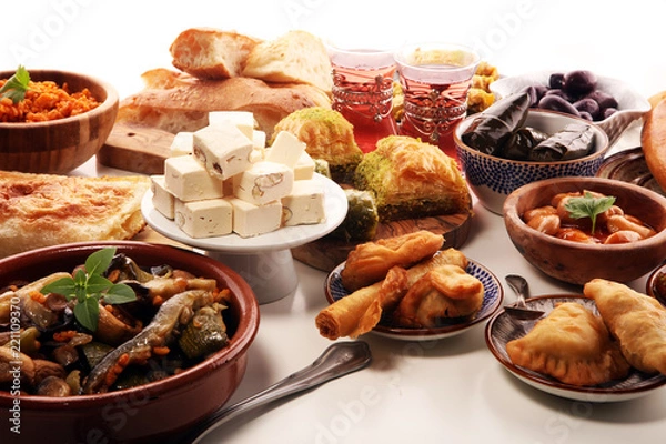 Fototapeta Middle eastern or arabic dishes and assorted meze, concrete rustic background. sambusak. Turkish Dessert Baklava with pistachio. Sarma. Halal food. Lebanese