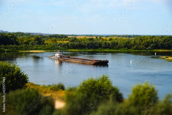 Fototapeta barge floating on the river