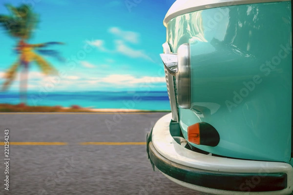 Obraz The vintage van rides along the coastal highway along the beach with palm trees. The concept of vacation, travel.