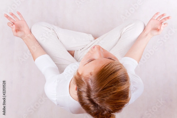 Obraz young woman relaxing (up view) - on white background