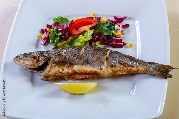 Obraz Grilled seabass with lemon