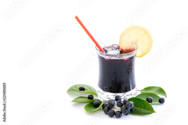 Fototapeta Fresh juice of chokeberry (Aronia melanocarpa) in glass and berry and leaves near, isolated on white background