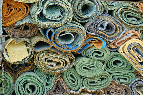 Obraz Disposed rolls of carpet padding.