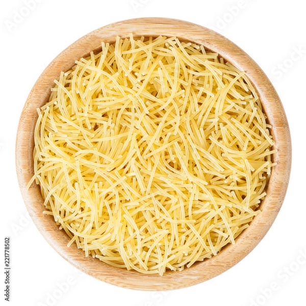 Fototapeta Uncooked vermicelli pasta in wooden bowl isolated on white background with clipping path