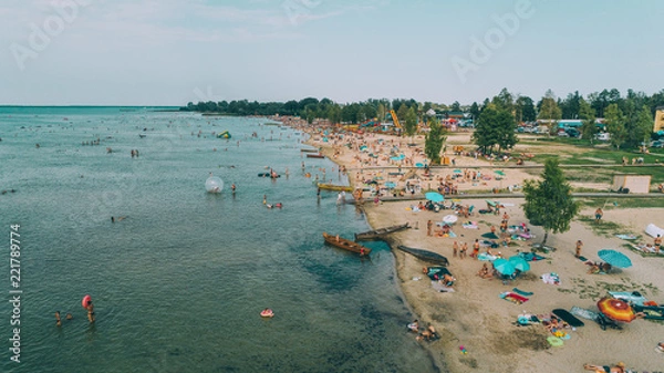 Fototapeta Aerial view of the beach. Transparent lake. People are sunbathing. Summer. Ukraine.