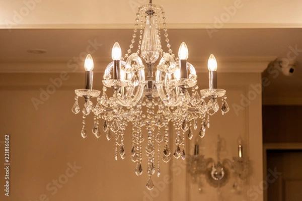 Fototapeta Chrystal chandelier lamp on the ceiling in Dining room Adjusting the image in a Luxury tone .Decorative elegant vintage and Contemporary interior Concept.