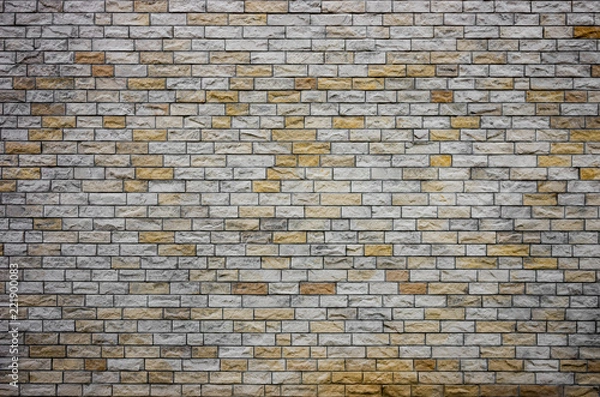 Fototapeta Brick wall made of natural stone bricks