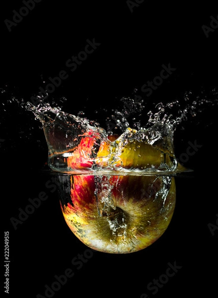 Obraz An apple dropped into liquid creating a beautiful splash