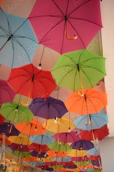 Fototapeta ceiling of a large number of colorful floating parasols