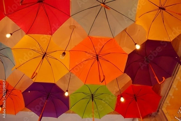 Fototapeta ceiling of a large number of colorful floating parasols