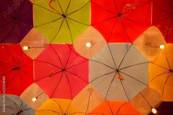 Fototapeta ceiling of a large number of colorful floating parasols