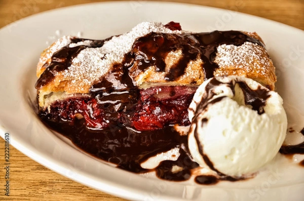 Fototapeta cherry strudel with chocolate and ice cream