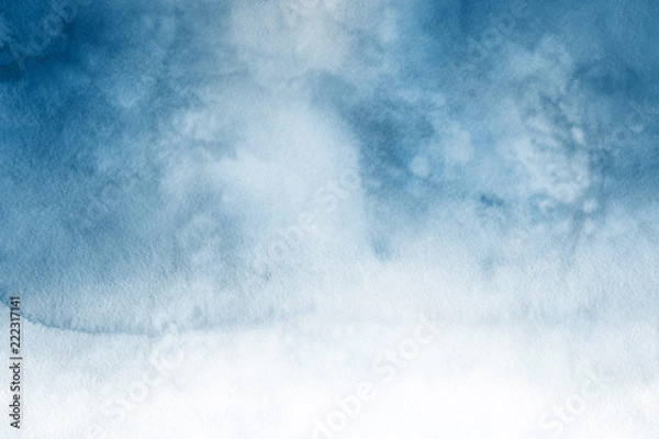 Fototapeta Blue winter watercolor ombre leaks and splashes texture on white watercolor paper background. Painted ice, frost and water.