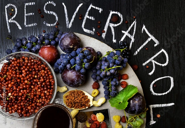 Fototapeta food rich with resveratrol, grapes, plums, goji, peanuts, cranberry,raspberrys, dark chocolate,red wine