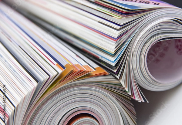 Fototapeta Rolled up magazines