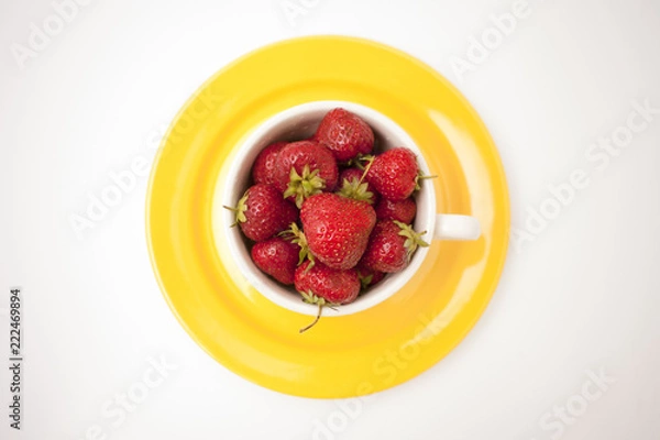 Obraz Strawberry on bright yellow plate