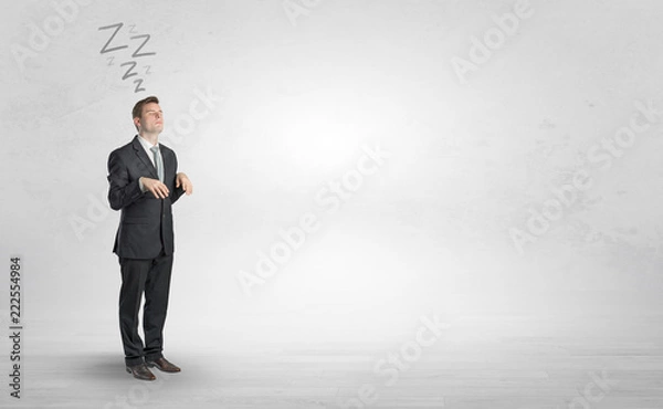 Fototapeta Tired businessman with sleeping sickness going somewhere
