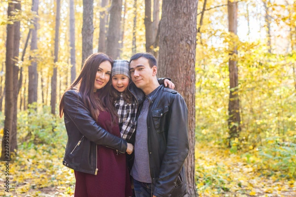 Obraz Parenthood, fall and people concept - young family happy in autumn park