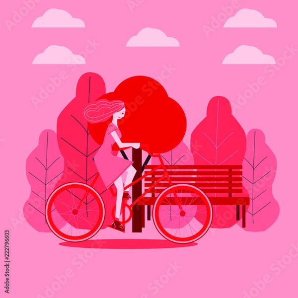 Fototapeta girl walking in a park on bike