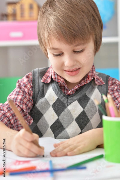Obraz Portrait of Little boy drawing at home