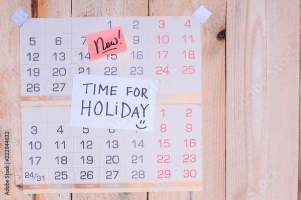 Fototapeta Time For Holiday written on paper note on a wall calendar with wooden background and copy space