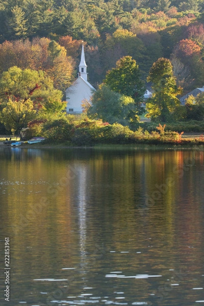 Obraz little church reflected in a pond in new england