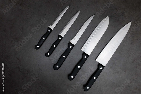 Fototapeta Knife set on a dark gray table