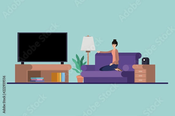 Fototapeta young woman watching tv on the livingroom