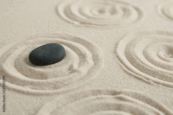 Obraz Pyramids of gray zen stones on the sand with wave drawings. Concept of harmony, balance and meditation, spa, massage, relax