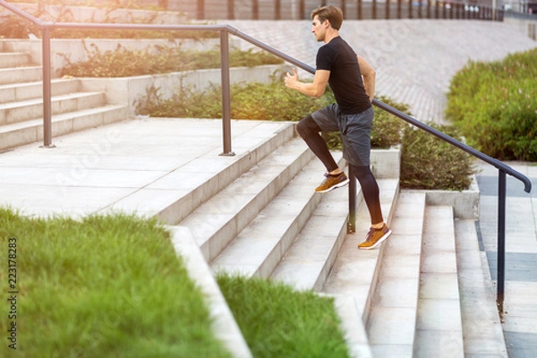 Fototapeta Man running in urban area
