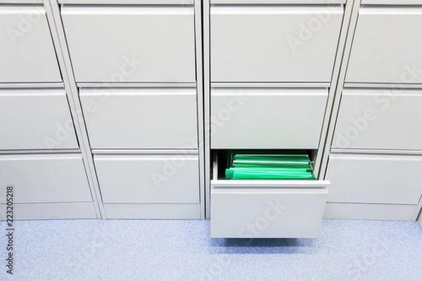 Fototapeta office document storage furniture grey closed all except one in the middle right