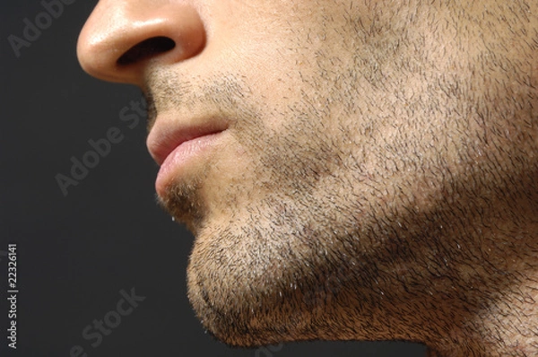 Obraz Handsome young man's face over white