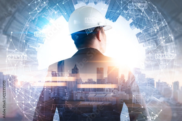 Obraz The double exposure image of the engineer standing back during sunrise overlay with cityscape image and futuristic hologram. The concept of engineering, construction, city life and future.