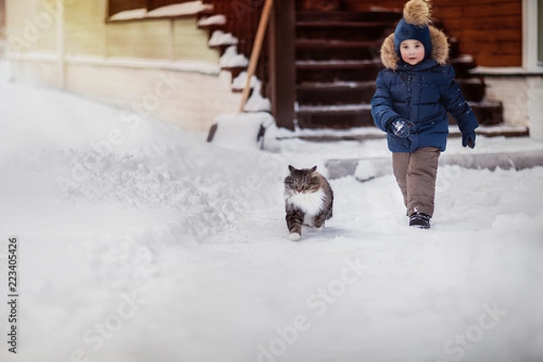 Obraz boy running with fluffy cat