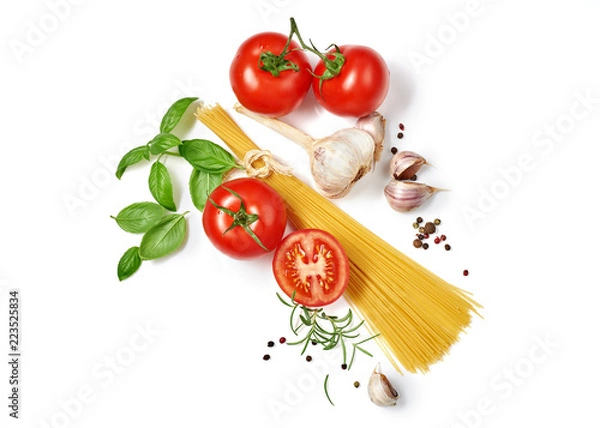 Fototapeta Spaghetti with tomatoes garlic and basil isolated on white background. Top view.