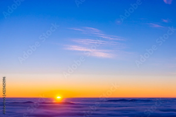 Obraz Amazing sunset over purple cloudy mountains