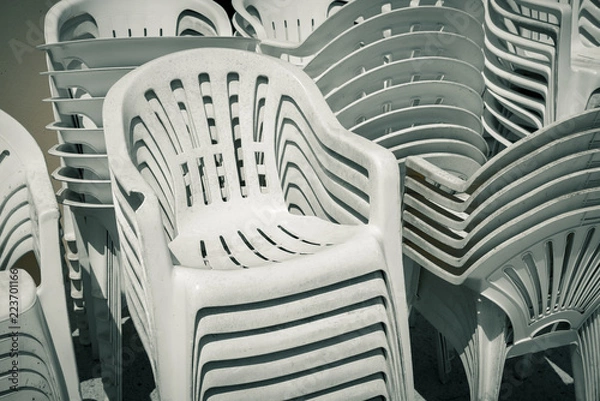 Obraz dirty old stacks of plastic chairs
