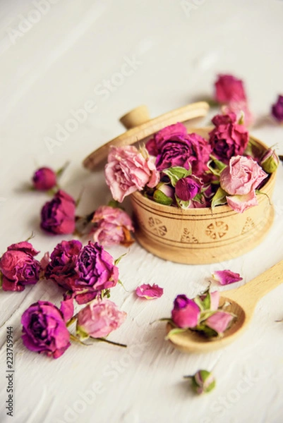 Obraz pink buds in a glass jar on a white background