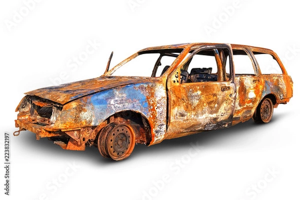 Fototapeta Burnout corrode car. Isolated on a white background with clipping paths and shadow. Crashed car wreck.