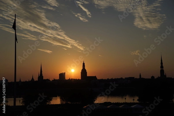 Fototapeta Beautiful view at the landscape of Oldtown  Riga, Latvia across the Daugava River at dawn
