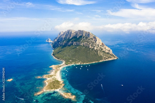 Fototapeta Spectacular aerial view of Tavolara's island bathed by a clear and turquoise sea, Sardinia, Italy.
