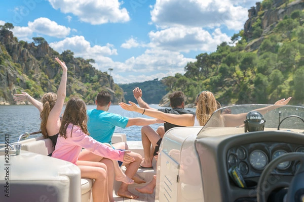 Fototapeta Group of friends sailing and having fun on a yatch