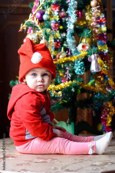 Fototapeta cute little girl in anticipation of the Christmas miracle