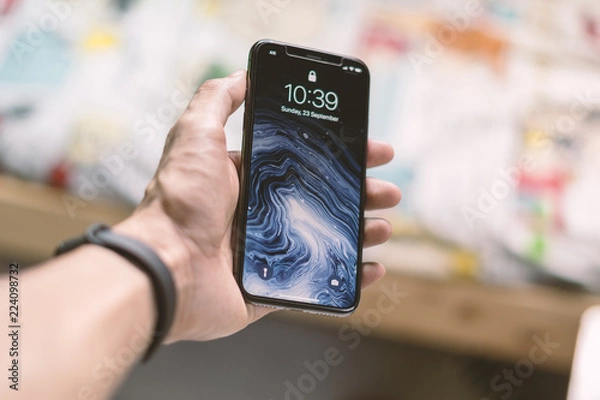 Obraz Hand holding mobile phone