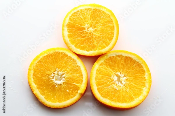 Fototapeta Orange Slice on white background / Orange is a citrus fruit that is quite delicious, juicy with high content Vitamin C. 